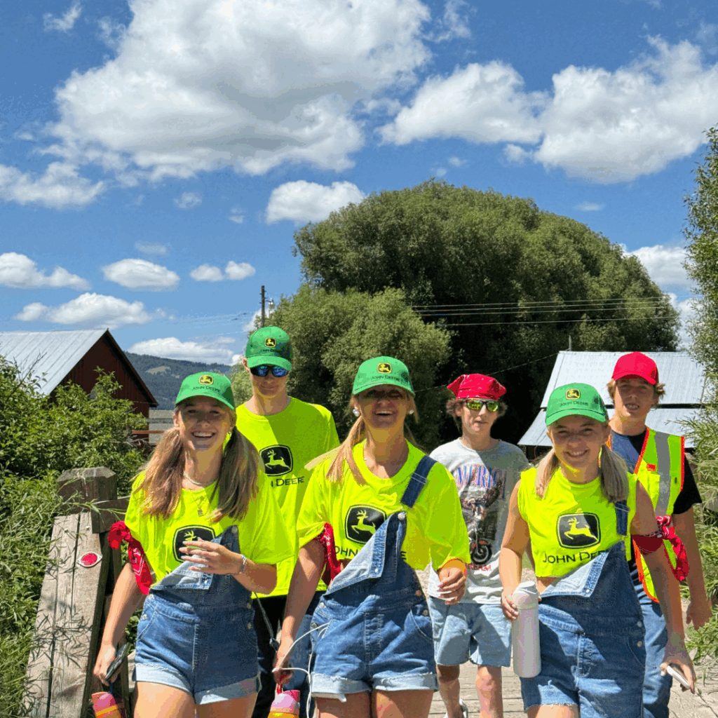 students dressed a minions with ovralls and shirts and ball caps 