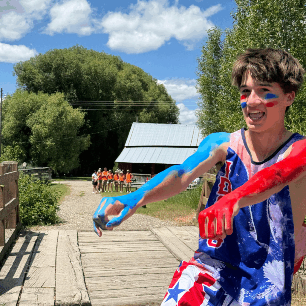 students covered in red, white, and blue paint 