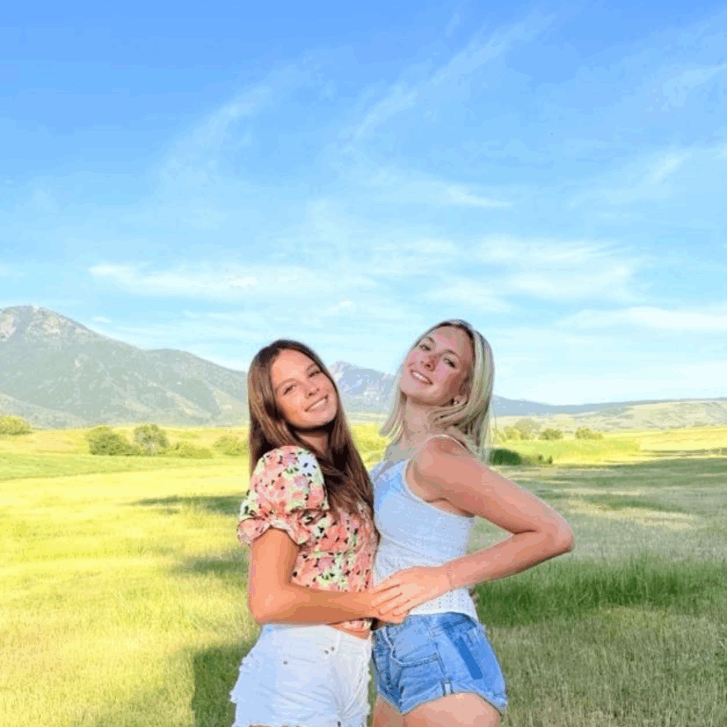 girls hugging in the idaho ranch field