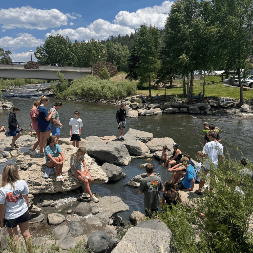 students soaking their feet in the pagosa springs