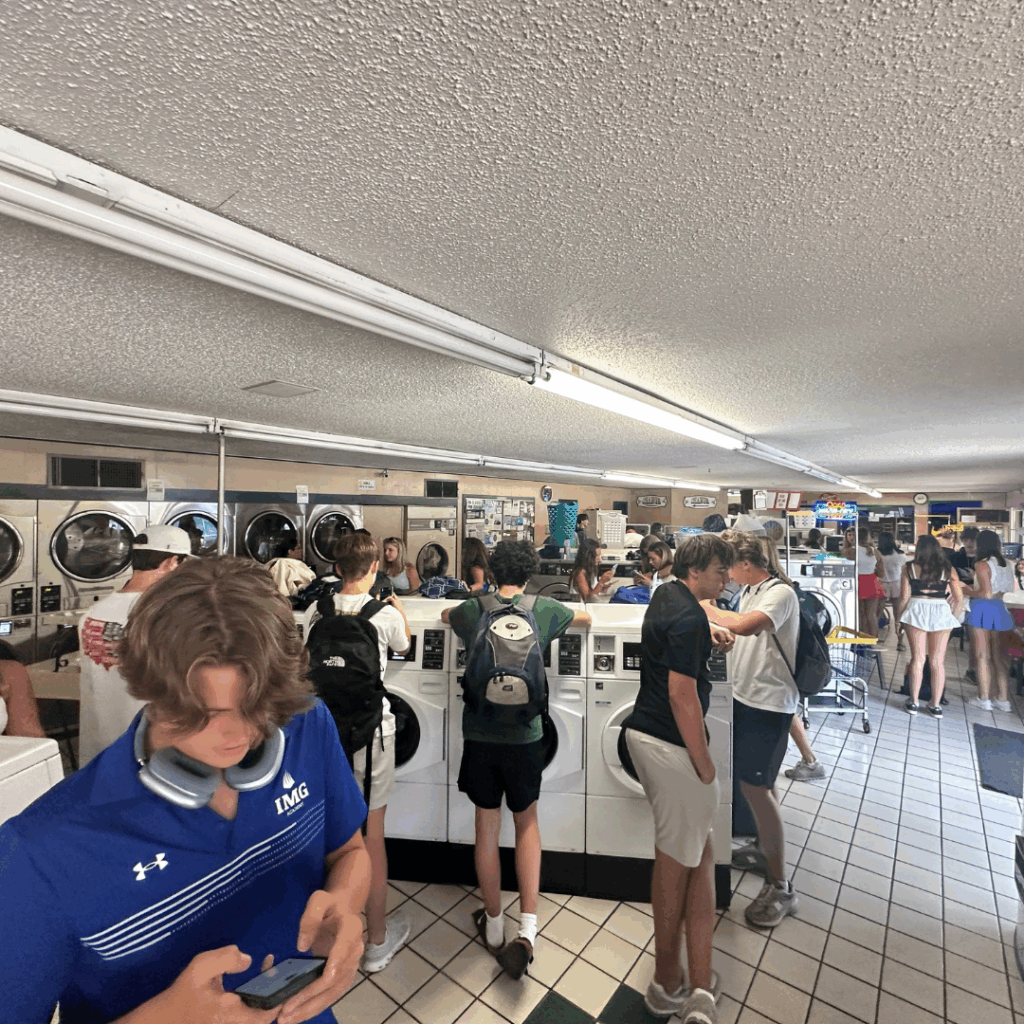 students doing laundry at a local laundromat