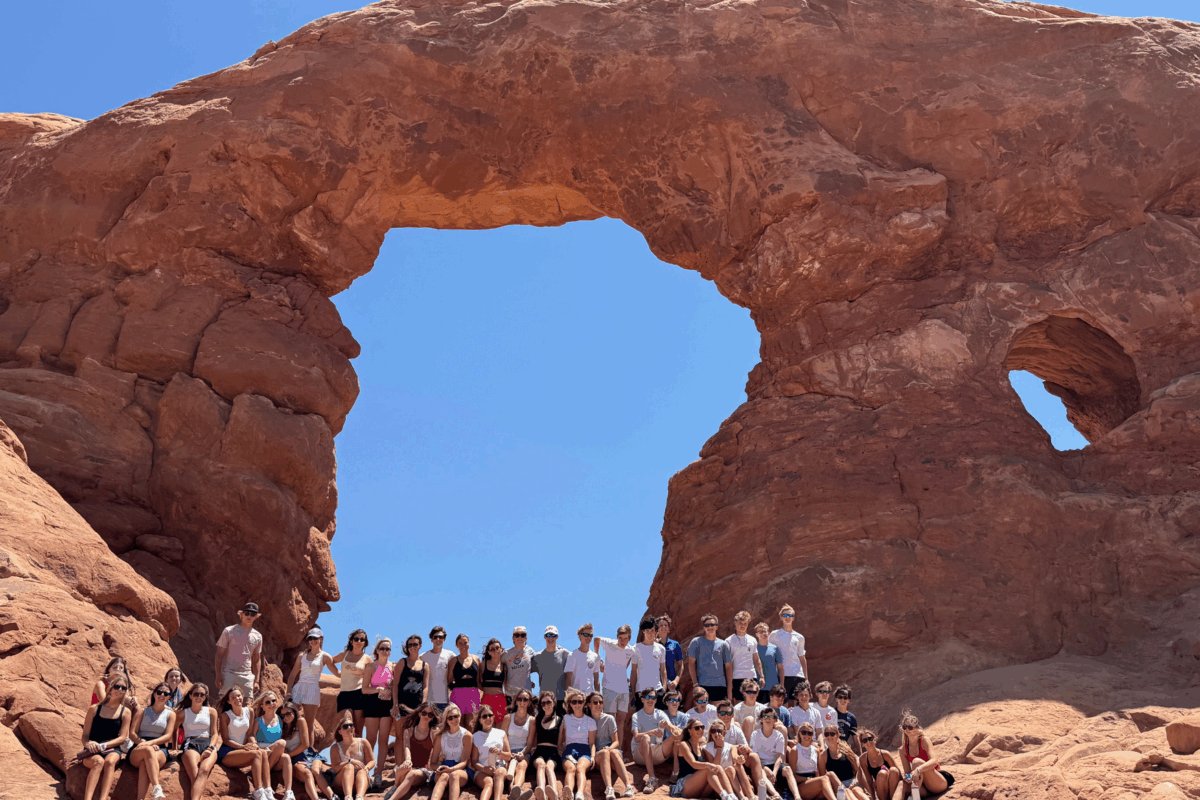 full group of students posing inside arches national park