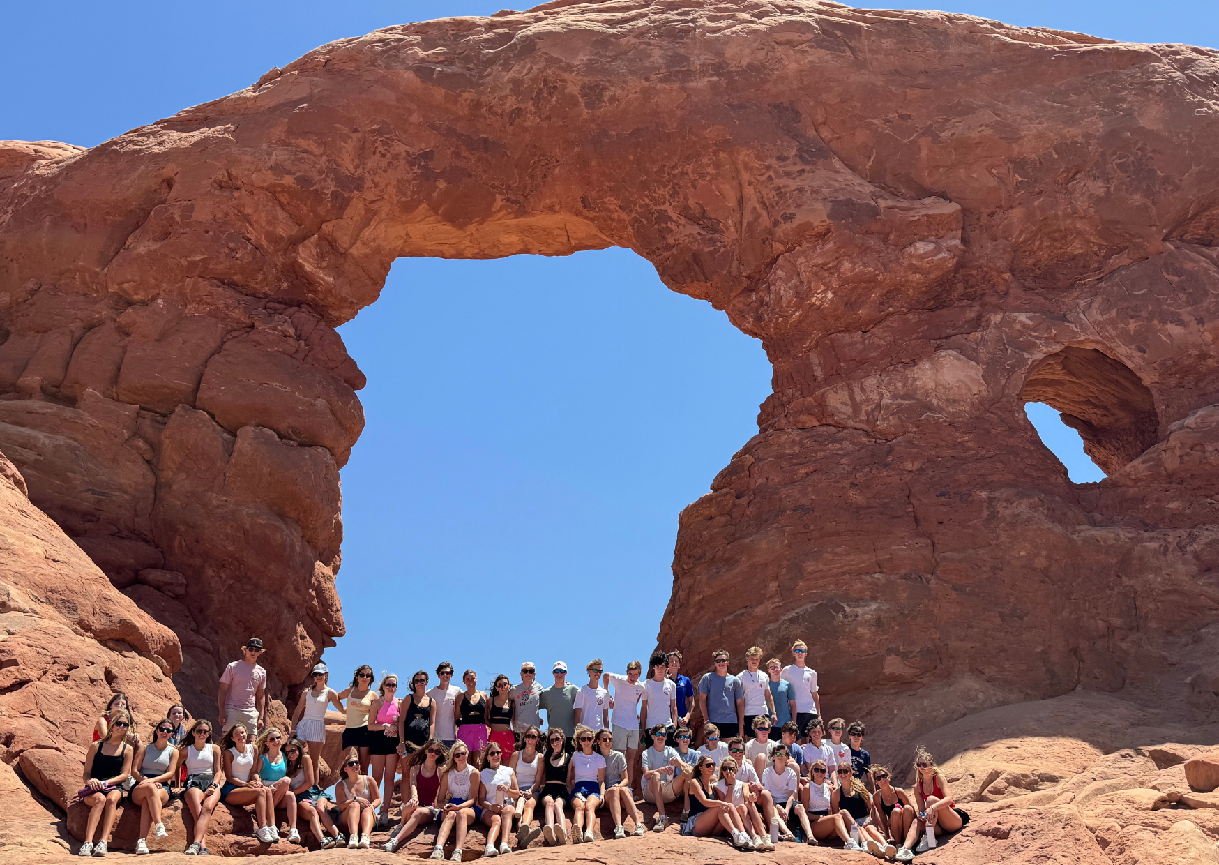 full group of students posing inside arches national park
