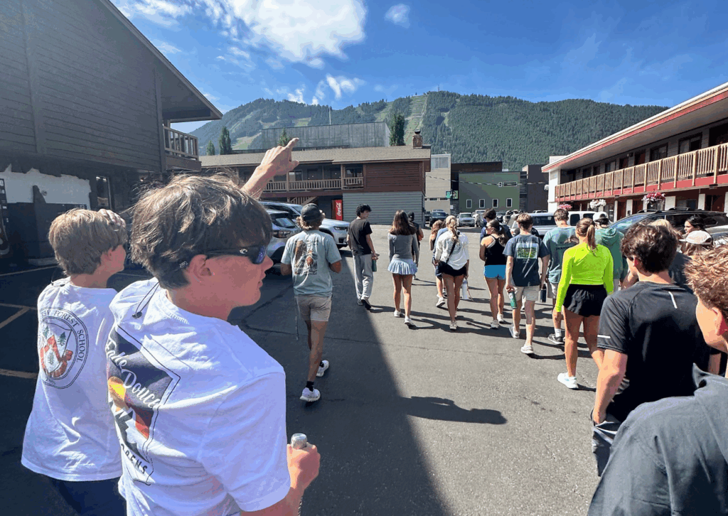 group of students walking into the rodeo