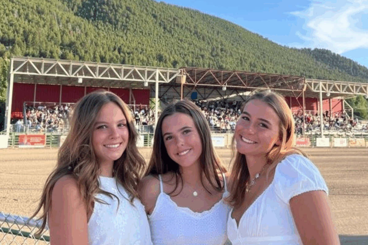 girls posing at the rodeo