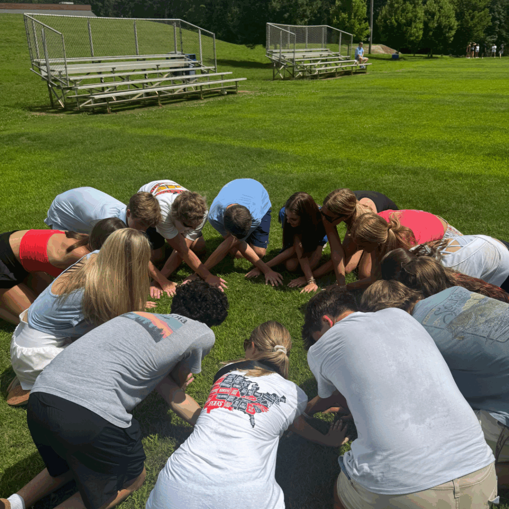students playing a game with their heads down 