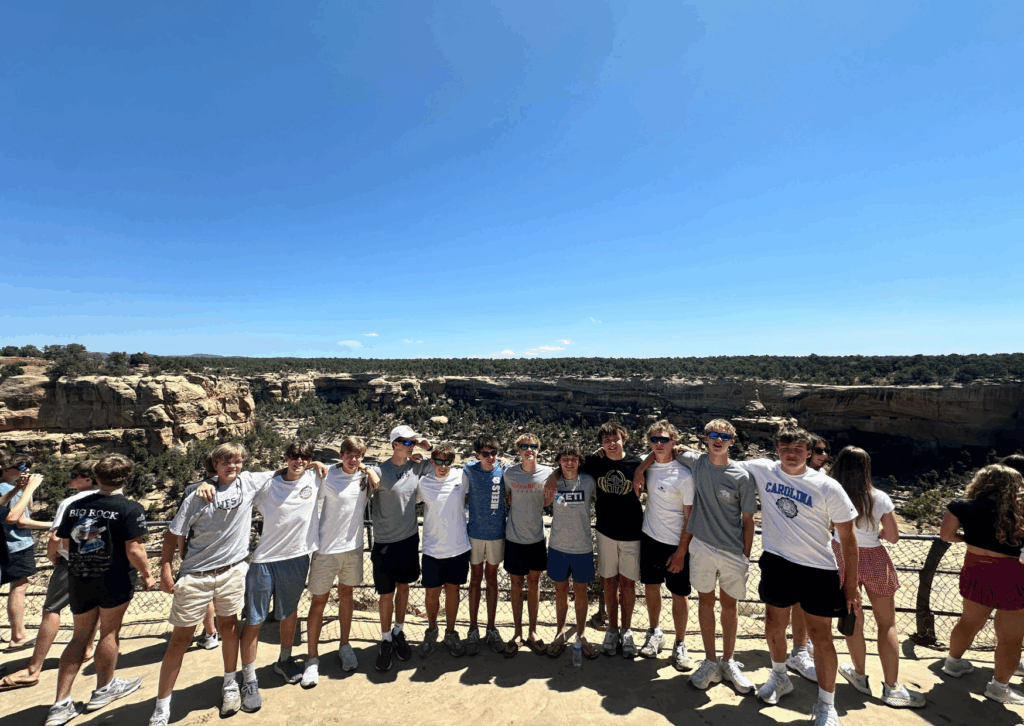 male students posing together with the backdrop of Durango
