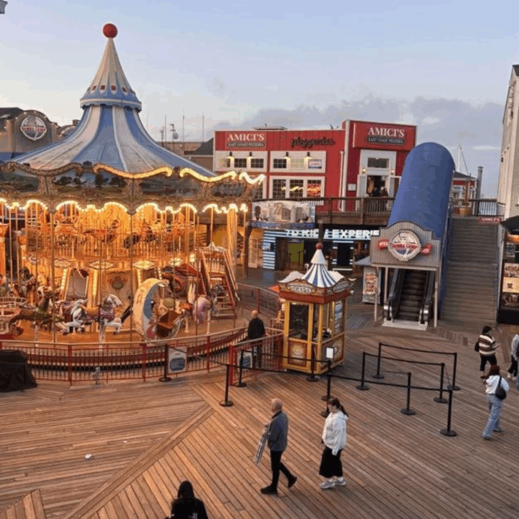 the pier at pismo beach with ferris wheel in the evening 