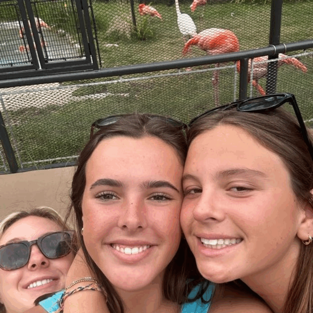 grand western tour students selfie at the flamingo exhibit 