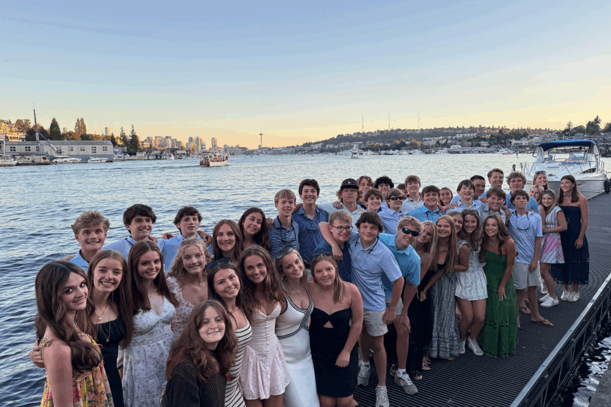 students posing together at the dock