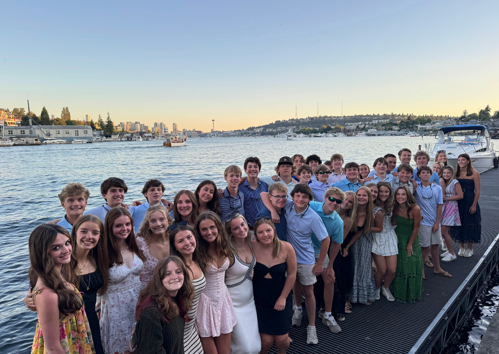 students posing together at the dock