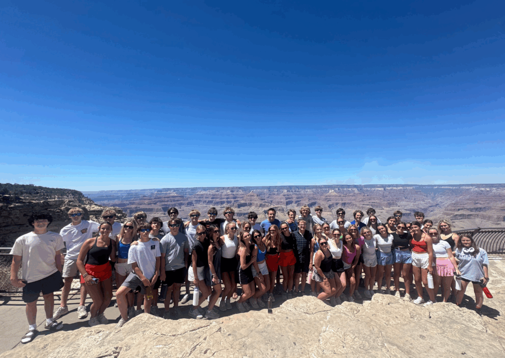 all students in a row at the canyon edge at a stop