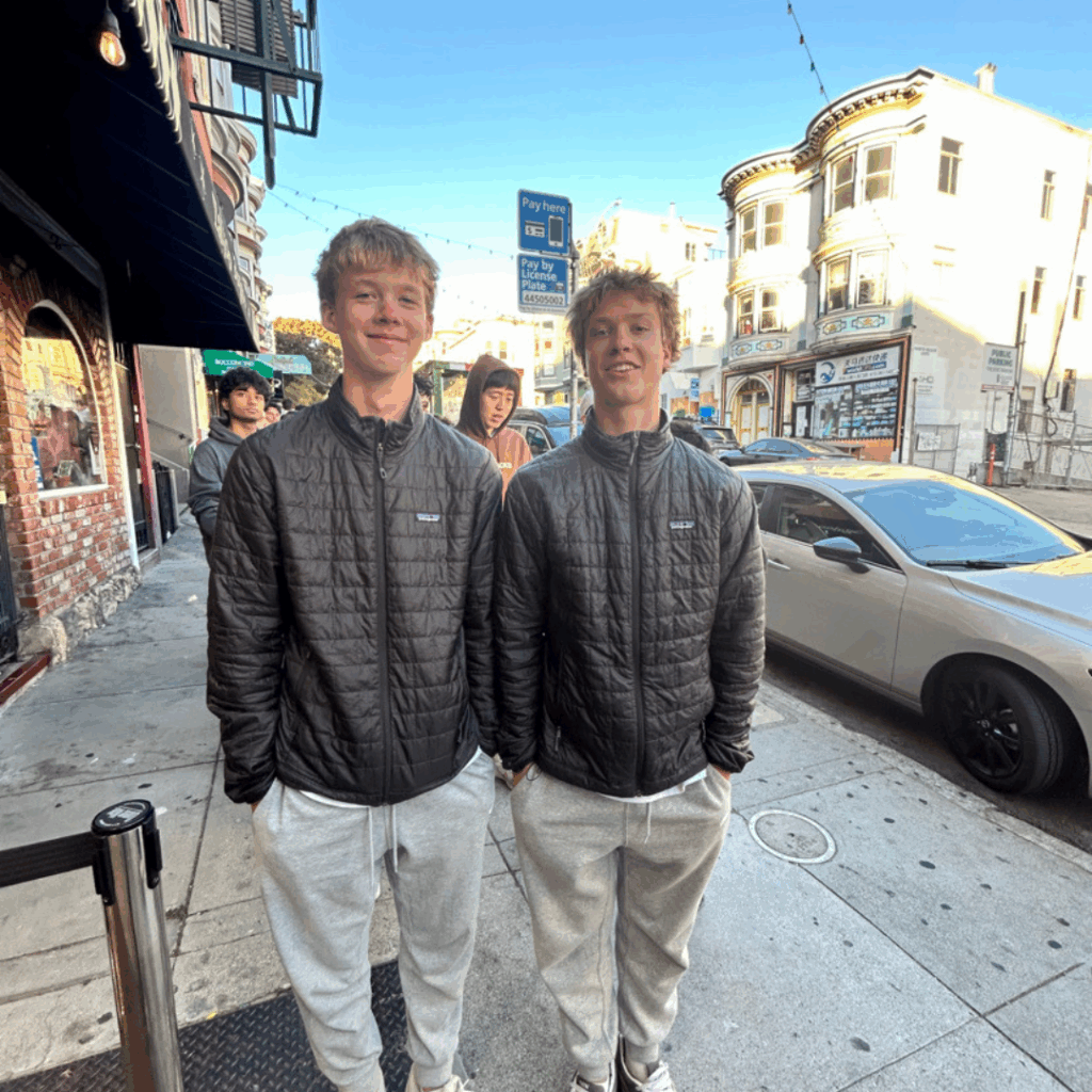 two students wearing matching patagonia jackets in downtown San Francisco