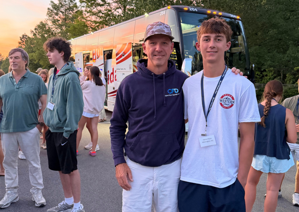 dad and student in front of the bus 