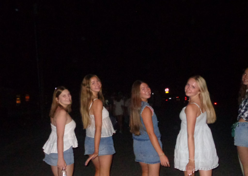 Four teen girls walking together at night in Jackson after the rodeo