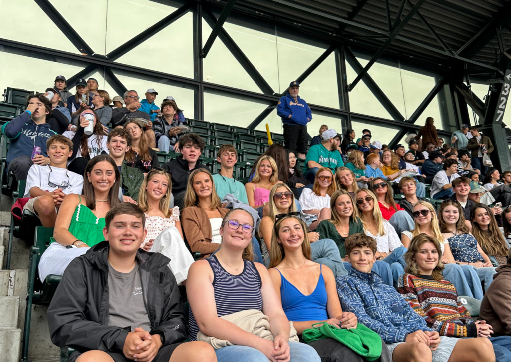 Large group of Grand Western Tour students seated together in the stands at a Seattle Mariners baseball game