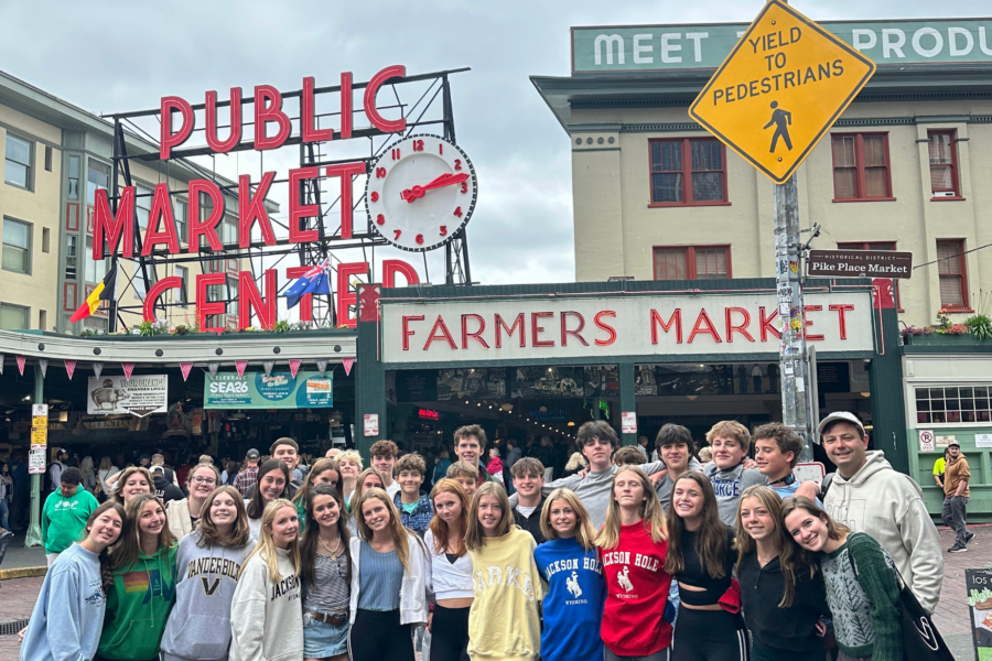 students standing in front of pike place market in seattle