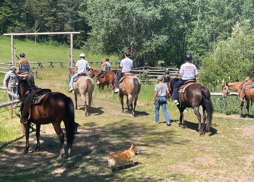 students horse back riding away