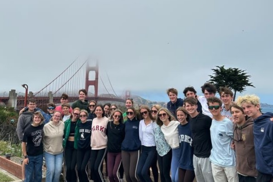 students in a line in front of the golden gate bridge