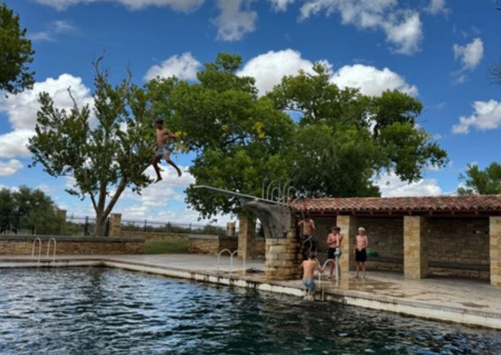 student diving off the board