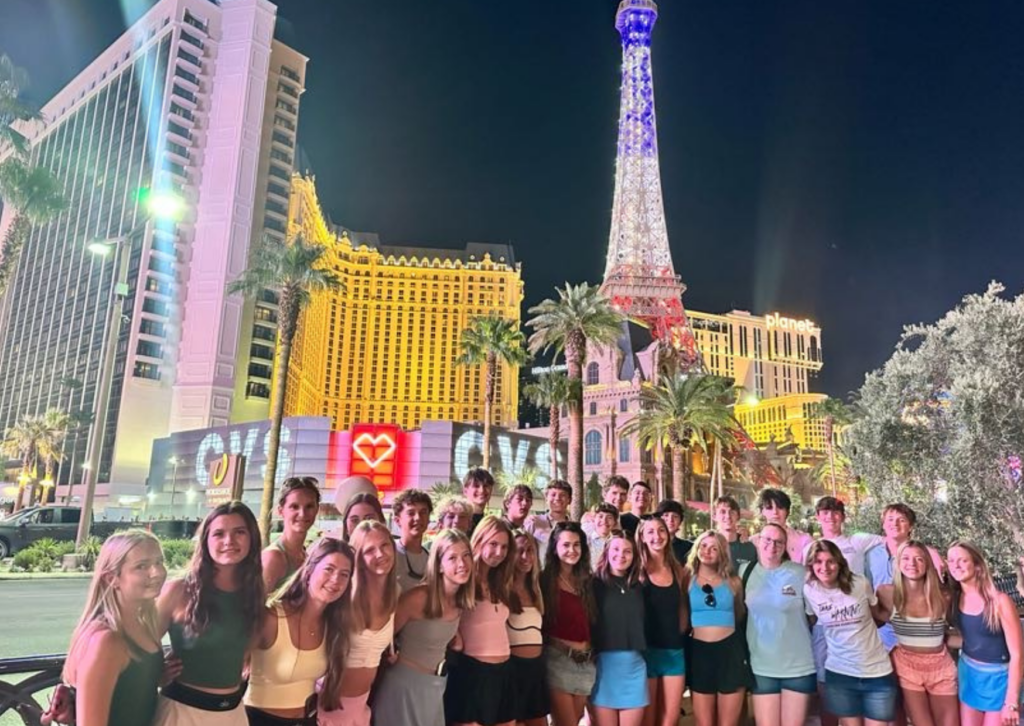 students in front of the eiffel tour in las vegas