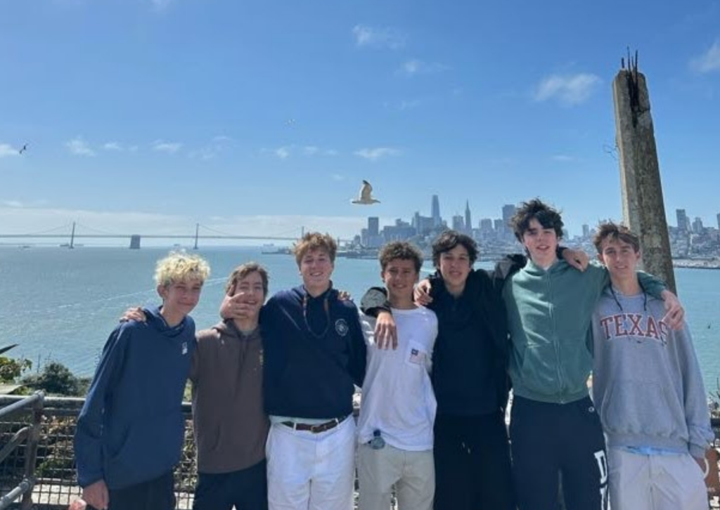 boys at the san fransisco wharf smiling