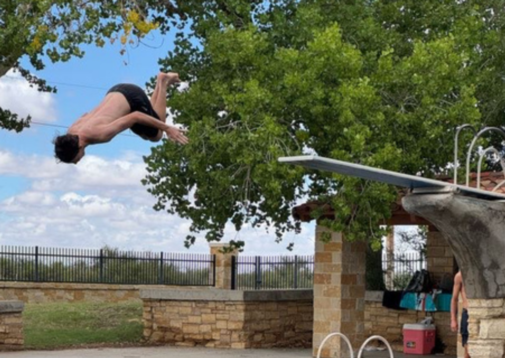 student diving off the high board in texas
