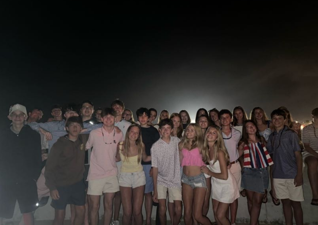 students all in a group at the fireworks display on fourth of july