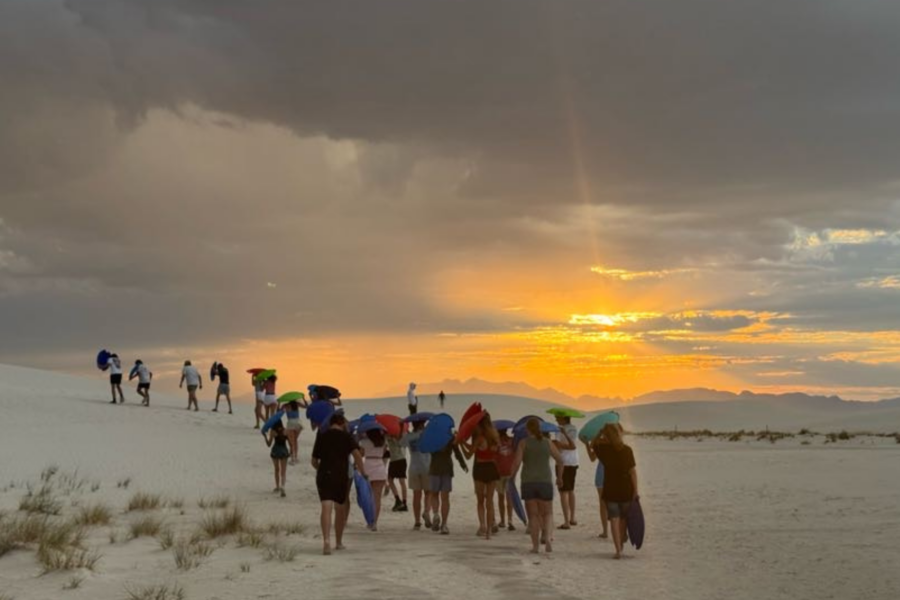 students walking on the white sands