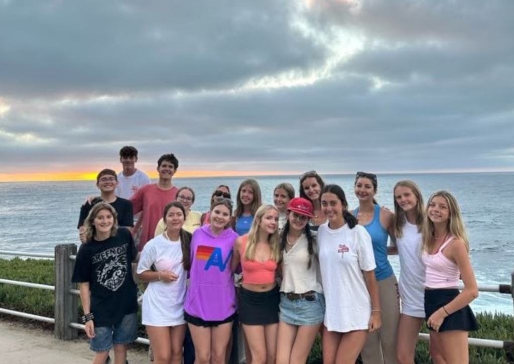 Group photo of campers together on the beach at sunset in La Jolla